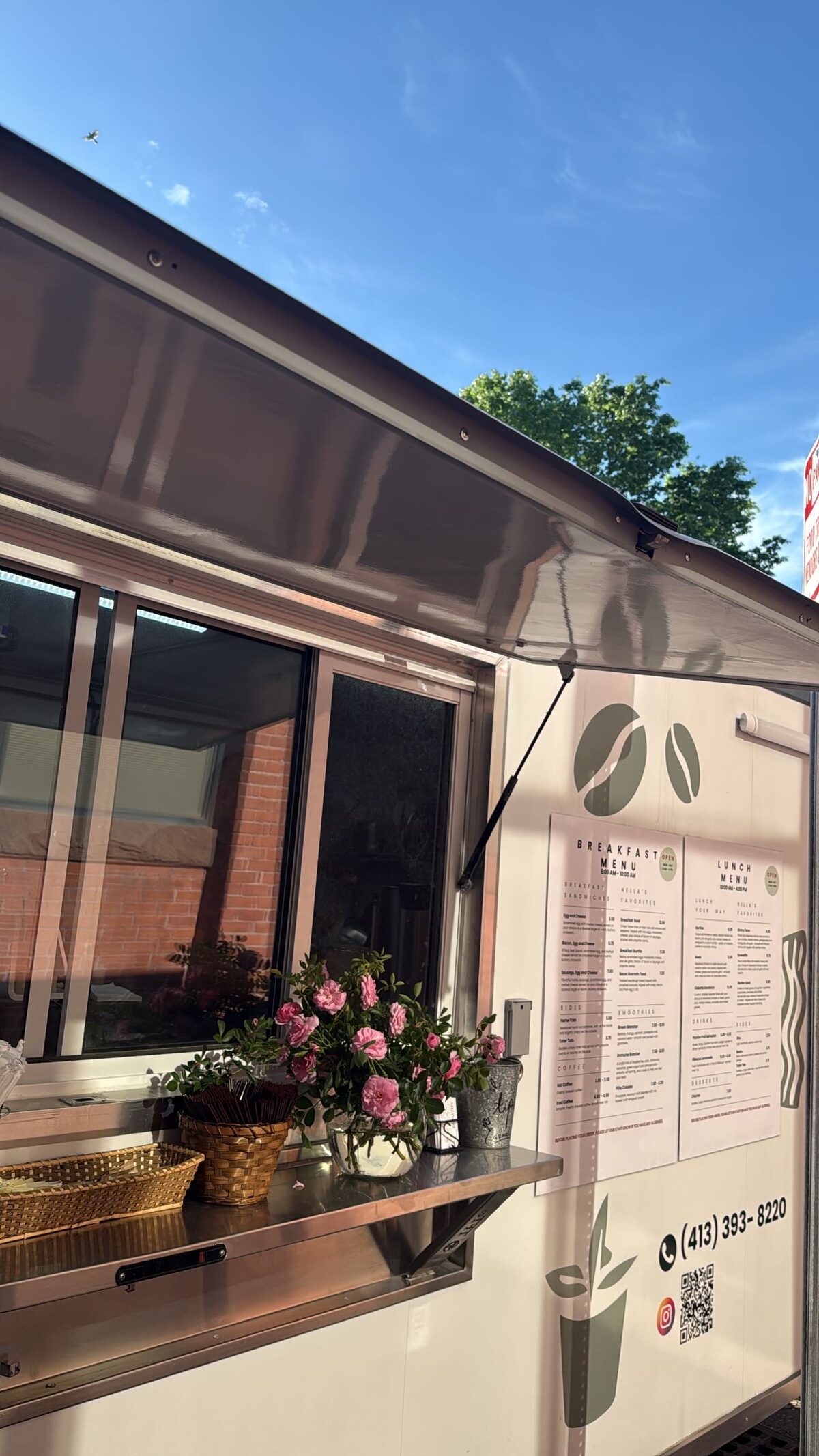 The Nella's Café trailer on Birnie Ave, service window open