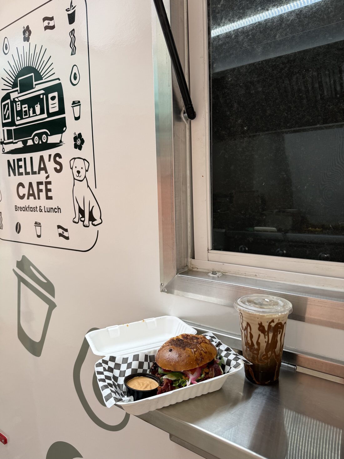 A ciabatta sandwich handed out at the service window